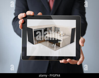 architecture concept: modular concrete house design on a businessman tablet Stock Photo