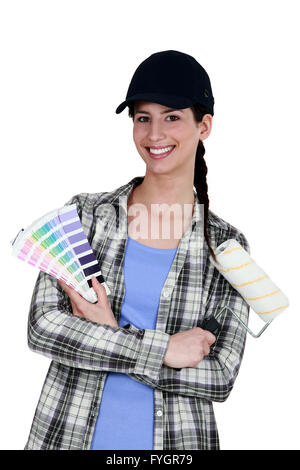 female painter holding a color chart Stock Photo - Alamy
