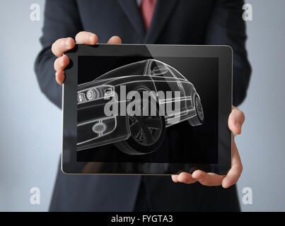 engineering car concept: lines car render on a businessman tablet Stock Photo