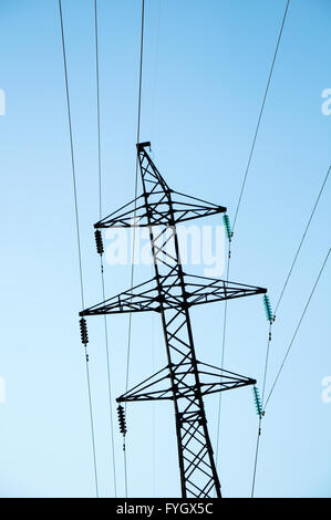 electricity tower on a blue background Stock Photo - Alamy