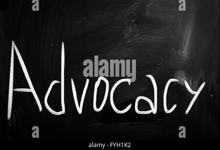 The word 'Advocacy' handwritten with white chalk on a blackboard Stock Photo