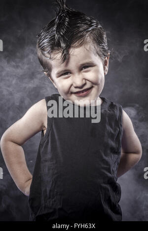 Pretty child rocker dress and funny expressions crested Stock Photo