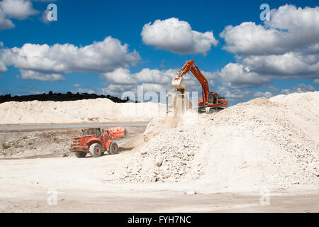 Vehicles working in an active stone quarry in Israel Stock Photo