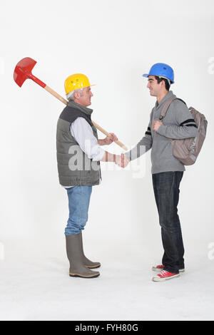 Experienced tradesman meeting his new apprentice