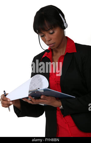 Call-center supervisor with clip-board and pen Stock Photo