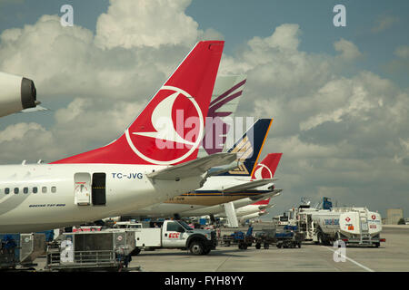 Airliners on the tarmac at Istanbul Airport, Turkey.  Aircraft from Turkish Airlines, Qatar Airlines, and Singapore Airlines. Stock Photo