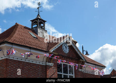 Union flags flying from Haslemere Town Hall in honour of the Queen's 90th birthday. Stock Photo