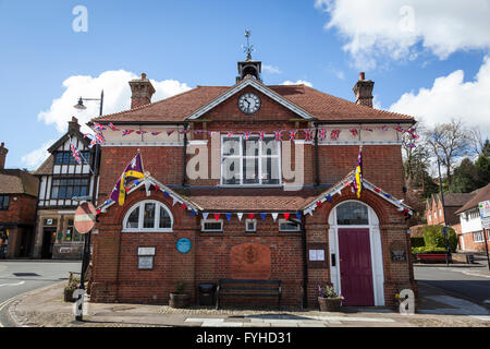 Union flags and bunting  flying from Haslemere Town Hall in honour of the Queen's 90th birthday. Stock Photo