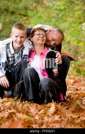 Happy family is having fun in the autumn Stock Photo