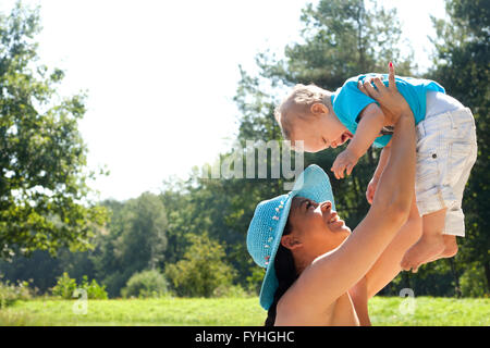Holding up my boy Stock Photo