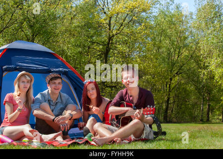 Youth on a camping having a great time Stock Photo