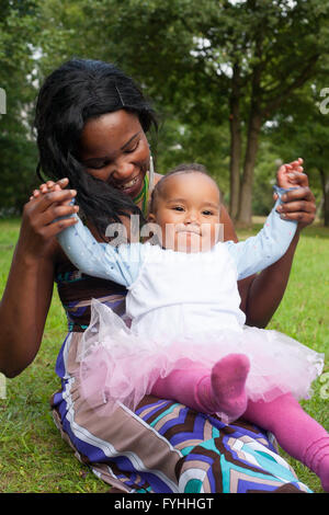 Mother is playing with her girl Stock Photo