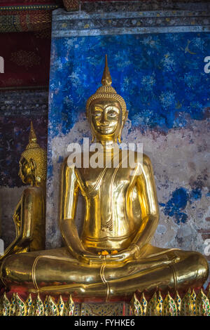 Golden buddhas in Wat Suthat, Bangkok, Thailand Stock Photo