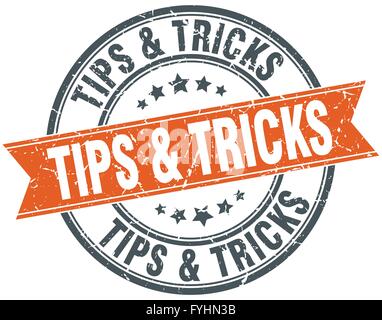 tips & tricks round orange grungy vintage isolated stamp Stock Vector