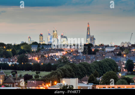 The skyline of London, including The Shard, seen over suburban streets and houses of Tooting in South London. Stock Photo