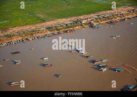 Boats at Port of Chong Khneas, Siem Reap River, near Tonle Sap Lake and Siem Reap, Cambodia - aerial Stock Photo