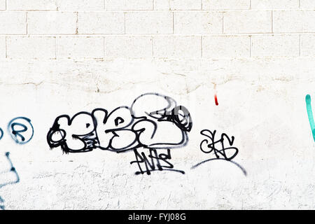 Graffiti on grunge wall Stock Photo