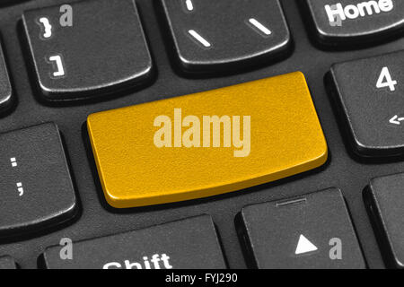 Computer notebook keyboard with blank yellow key Stock Photo