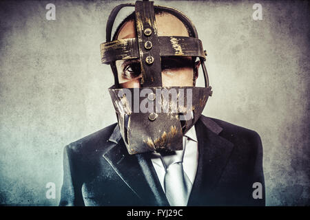 dangerous business man with iron mask and expressions Stock Photo