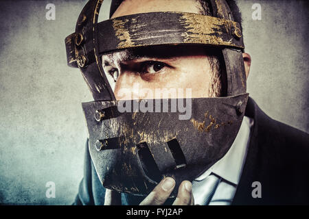 fury, dangerous business man with iron mask and expressions Stock Photo