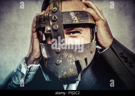 hate, dangerous business man with iron mask and expressions Stock Photo