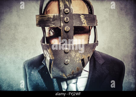 danger, dangerous business man with iron mask and expressions Stock Photo