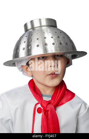 Isolated funny little boy cook in uniform over vintage  background Stock Photo