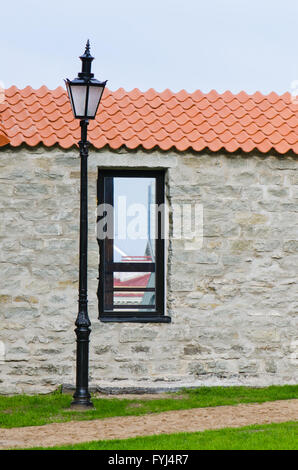 Window aperture in a wall from calcareous stones, a close up Stock Photo