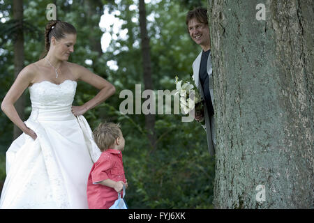 Groom playing hide and seek with his son Stock Photo