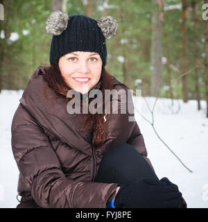 Portrait of the charming young woman in winter outdoors Stock Photo