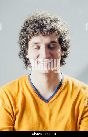 Detailed portrait of a young caucasian guy with curly hair Stock Photo