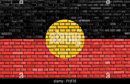 Australian Aboriginal flag painted on the cracked grunge concrete wall ...