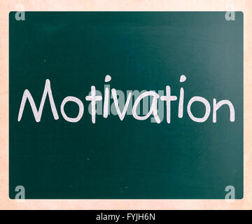 Motivation handwritten with white chalk on a blackboard Stock Photo