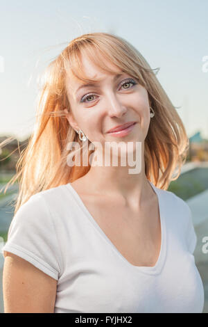 blonde 20s women head and shoulders outdoor against sky Stock Photo