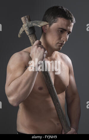 Construction worker portrait holding a peak. Stock Photo