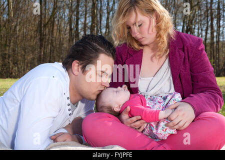 Daddy is kissing his baby girl Stock Photo