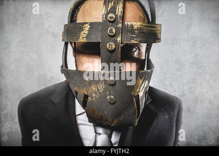 danger, dangerous business man with iron mask and expressions Stock Photo