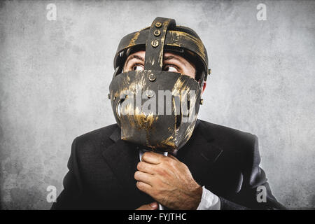 screaming, dangerous business man with iron mask and expressions Stock Photo