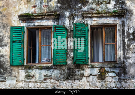 Window with louvers in old house Stock Photo