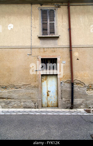brown door  europe  italy  lombardy       in  the milano old   water pipe Stock Photo
