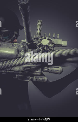 Science, Future soldier with huge weapon, sci-fi scene Stock Photo