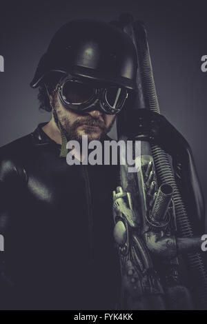 Fantasy, Future soldier with huge weapon, sci-fi scene Stock Photo