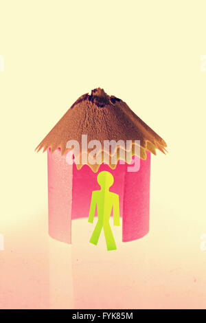 Paper house with paperman, Concept Stock Photo