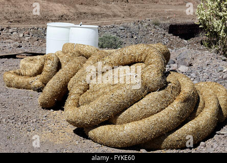 Construction erosion pollution control straw wattle tubes in coils Stock Photo