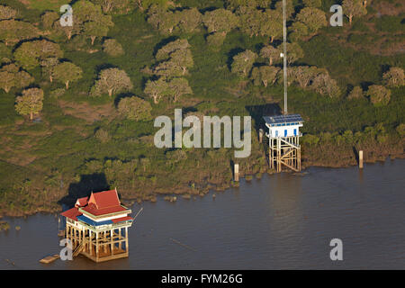 Temple on stilts and communications aerial, Tonlé Sap Lake, near Siem Reap, Cambodia - aerial Stock Photo