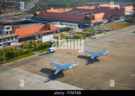 Private jets at Siem Reap International Airport, Siem Reap, Cambodia - aerial Stock Photo