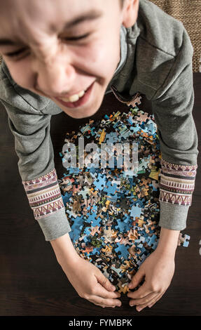 Child and puzzle. Stock Photo