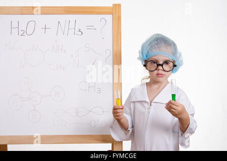 Chemist girl in points and with two tubes at board Stock Photo