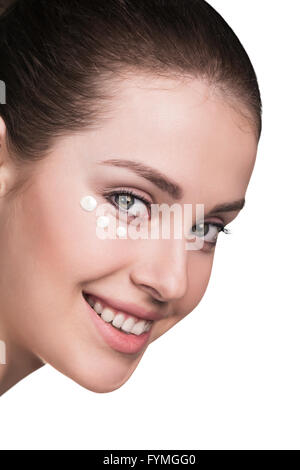 Girl with cream dots on face Stock Photo