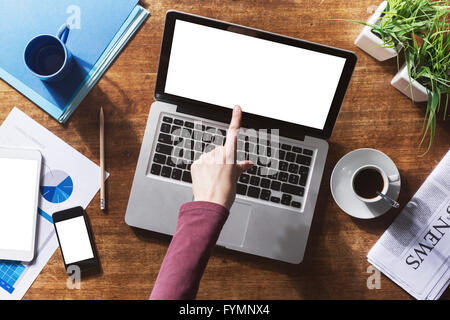 Corporate identity mock up on a wooden desktop with laptop, tablet and smartphone Stock Photo
